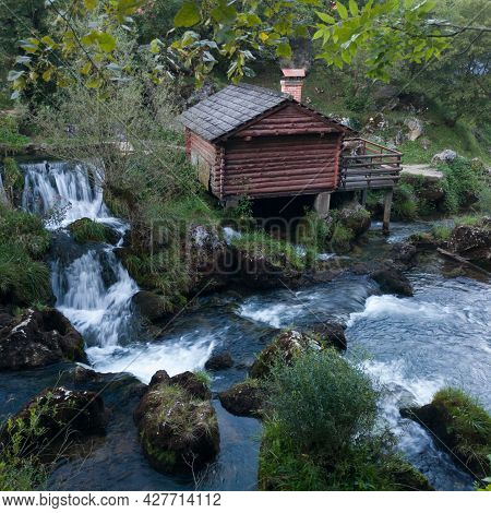 Small Traditional Wooden Water Mill By The Wild River Krupa With Big Rocks And Cascades On Popular T