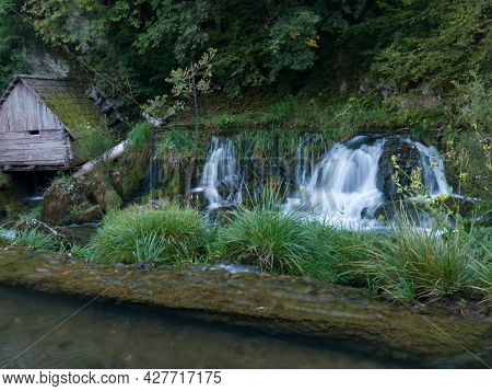 Rocks And Cascades On Wild Stream Krupa And Small Wooden House On Popular Picnic Place Krupa Na Vrba