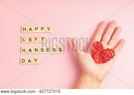 Text Happy Left Handers Day Written With Wooden Letters And Heart