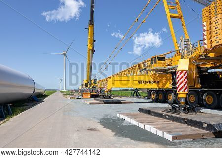 Zeewolde, The Netherlands - Juli 17, 2021: Dutch Construction Site New Wind Turbine Farm In Zeewolde
