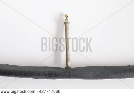 Inner Tube With Presta Valve Or French Valve On Background.