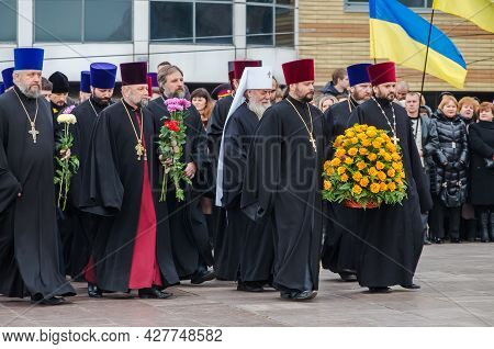 Orthodox Priests Of The Moscow Patriarchate (currently Illegitimate In Ukraine) Lay Flowers At Monum