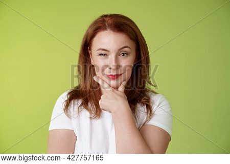 Hmm Interesting Choice. Intrigued Cunning Redhead Middle-aged Female Hold Hand Face-line Rub Chin Th