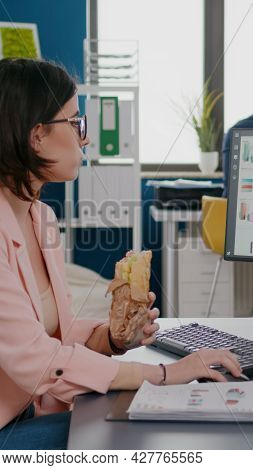Businesswoman Eating Tasty Sandwich Having Meal Break Working In Business Company Office During Take