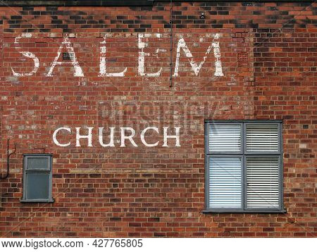 Leeds, West Yorkshire - 17 June 2021: Old Painted Sign On The Historic Salem Chapel As The Oldest Su