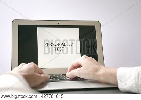 Woman Hand On Computer Laptop With The Word Personality Test On Screen. Career Or Job Interview Conc