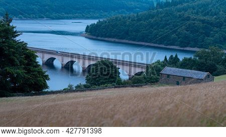 Ladybower Reservoir, Peak District Uk: Car Crossing The Viaduct