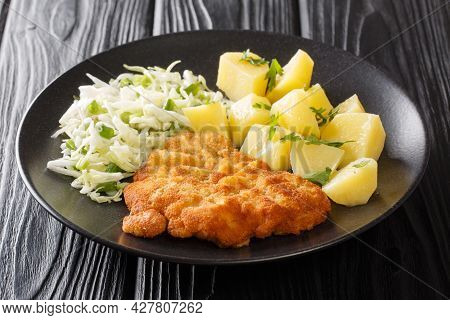 Kotlet Schabowy Is A Polish Pork Schnitzel Covered With Breadcrumbs Served With Potatoes And Fresh S