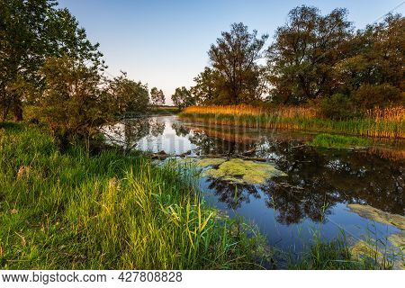 Sunset Over Warta River In Warta Landscape Park, Ladek, Poland.