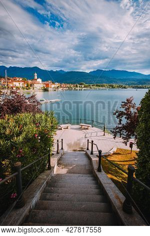 Feriolo, Verbania / Italy - June 2021: Feriolo Village On Lake Maggiore With Cloudy Sky And Steps To