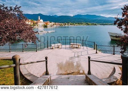Feriolo, Verbania / Italy - June 2021: Feriolo Village On Lake Maggiore With Cloudy Sky And Steps To