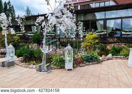 Lacu Rosu, Romania- 25 July 2021: Small Garden Pond With Beautiful Flowers At A Local Hotel.