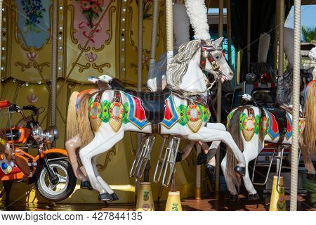 Colorful Horse On Traditional Old French Caroussel In City Park In Sunny Day