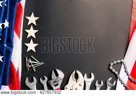 Labor Day Concept, Top View Flat Lay Of Different Kinds Wrenches With American Flag On Black. First 