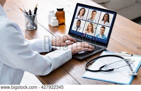 Cropped Shot Of Lady Doctor Making Video Call With Colleagues