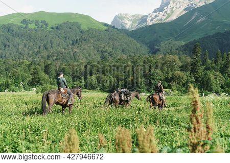 Horses A Group Of Riders On The Plain Near