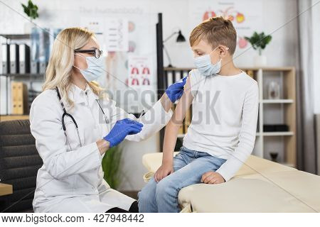 Medicine And Vaccination Concept During Pandemic. Beautiful Qualified Blond Woman Doctor Ready To Pr