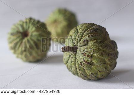 Cherimoya Is A Green, Cone-shaped Fruit With Leathery Skin And Creamy, Sweet Flesh. It Is Also Known