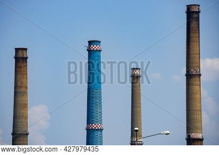 Bucharest, Romania - July 12, 2021: The Chimneys Of The Cet Sud Power Plant, Which Pollute With Smok