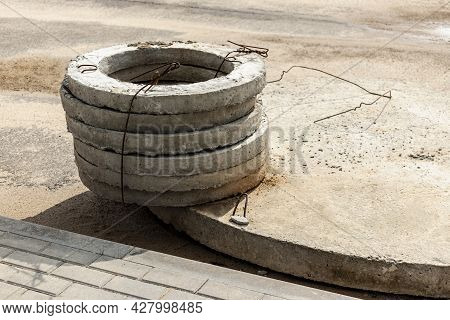 Installation Of Concrete Sewer Wells In The Ground At The Construction Site. The Use Of Reinforced C