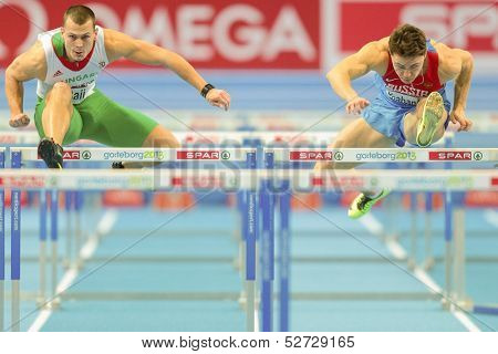 GOTHENBURG, SWEDEN - MARCH 1 Balazs Baji (Hungary) wins heat 2 of the qualification of the men's 60m hurdles event during the Athletics Indoor Championship on March 1, 2013 in Gothenburg, Sweden.
