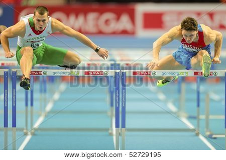 GOTHENBURG, SWEDEN - MARCH 1 Balazs Baji (Hungary) wins heat 2 of the qualification of the men's 60m hurdles event during the Athletics Indoor Championship on March 1, 2013 in Gothenburg, Sweden.