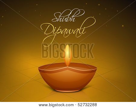 Indian festival of lights Shubh Dipawali (Happy Dipawali) concept with illuminated tradition oil lit lamp on shiny brown background. 