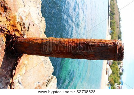 Rusty mooring capstan on a pier