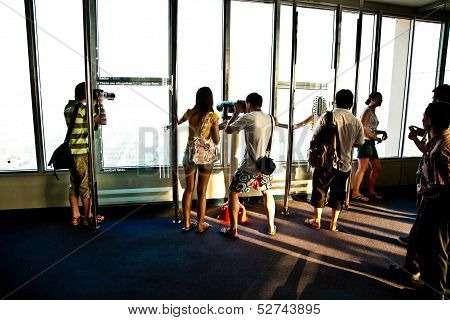People Enjoying View Across Bangkok Skyline