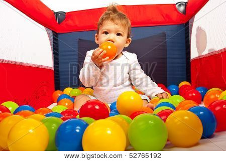 Baby Inside Playpen With Balls