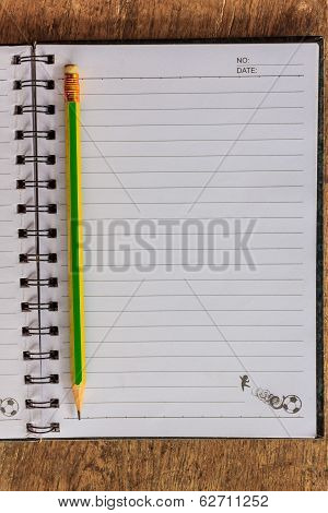 Notepad On Wooden Table
