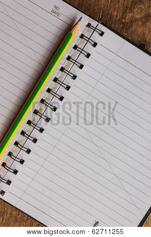 Notepad On Wooden Table