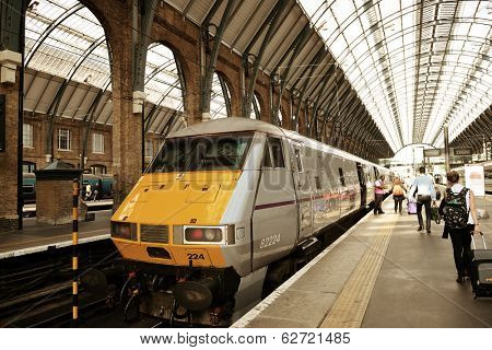 LONDON, UK - SEP 27: Kings Cross station with train on September 27, 2013 in London, UK. Opened in 1852, it is the southern terminus of the East Coast Main Line.