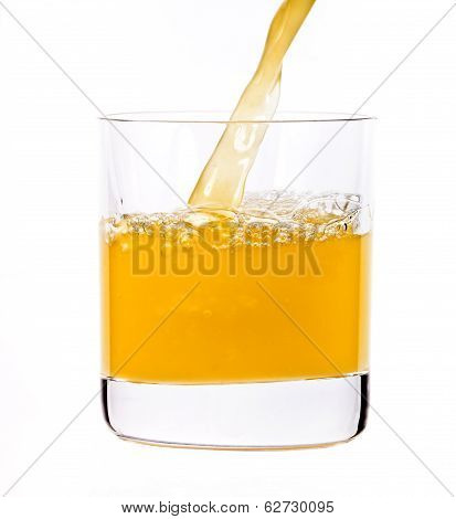 Juice Pouring Into The Glass