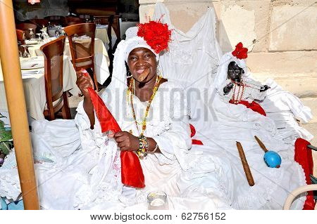 A smiling woman with a huge cigar