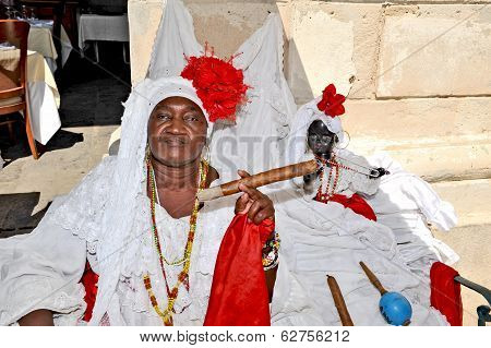 A smiling woman with a huge cigar