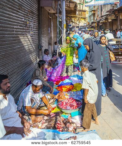 Man Sells Fruits At The Vegetable Street Market In Delhi