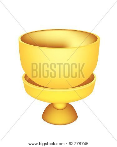 A Golden Bowl With Pedestal On White Background