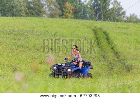 Elegant Woman Riding Extreme Quadrocycle