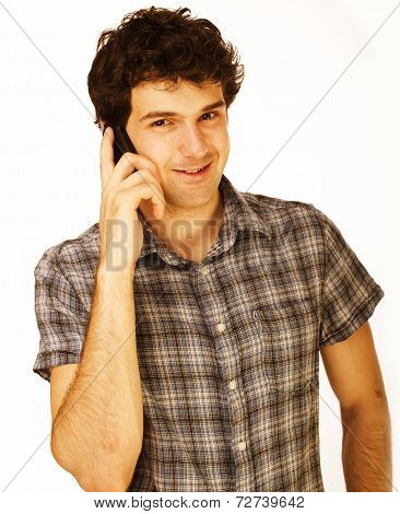 Portrait of handsome young man using cellphone isolated