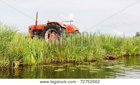 Farmers Pumping Water With Old Tractor