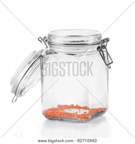 Remnants of lentils in glass jar isolated on white