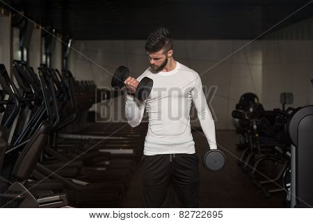 Male Athlete Doing Heavy Weight Exercise For Biceps