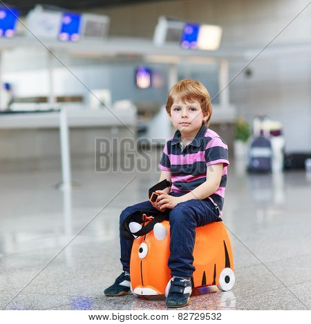 Little Boy Going On Vacations Trip With Suitcase At Airport