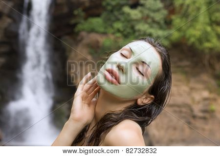 Woman With Green Clay Facial Mask In Beauty Spa (outdoor)