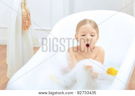 Cute little girl in the bathroom
