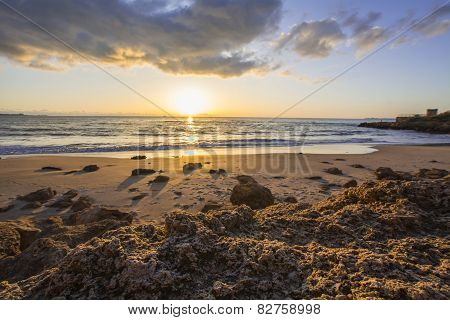 Landscape Of Rocky Beach At Sunset