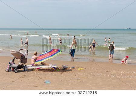 Seaside Visitors  Relaxing At Dutch Beach Of Scheveningen