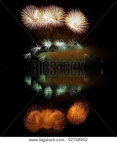 Colorful Fireworks With Reflection On Lake.