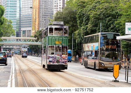 HONG KONG - JUNE 03, 2015: double-decker tram on street of HK. Hong Kong Tramways is a tram system in Hong Kong, being one of the earliest forms of public transport in the metropolis.
